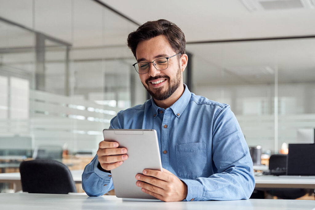 Man reviewing documents on tablet